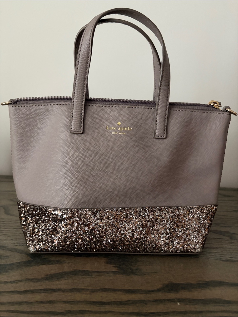 kate spade mauve tote with glitter bottom and gold logo